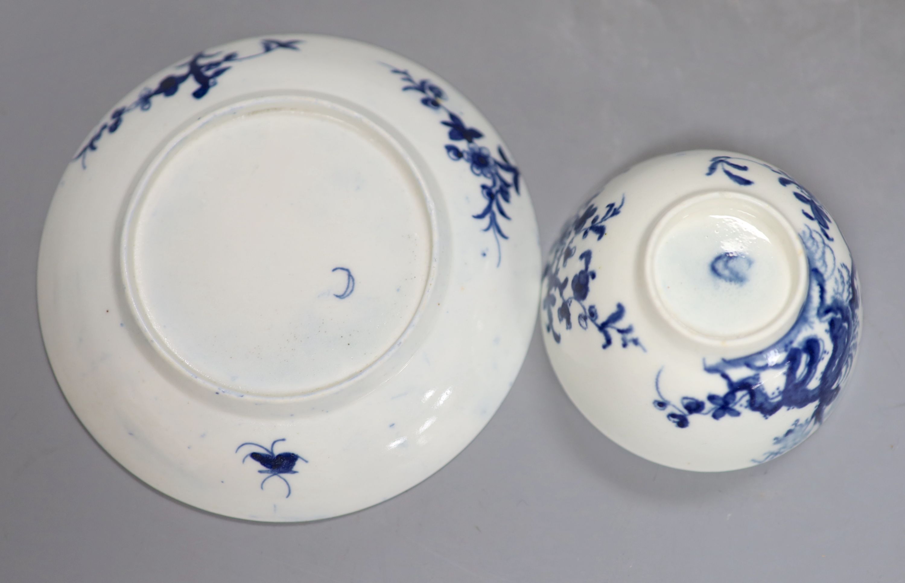 An 18th century Worcester prunus root pattern tea bowl and saucer, diameter 11.5cm, early large crescent mark to both